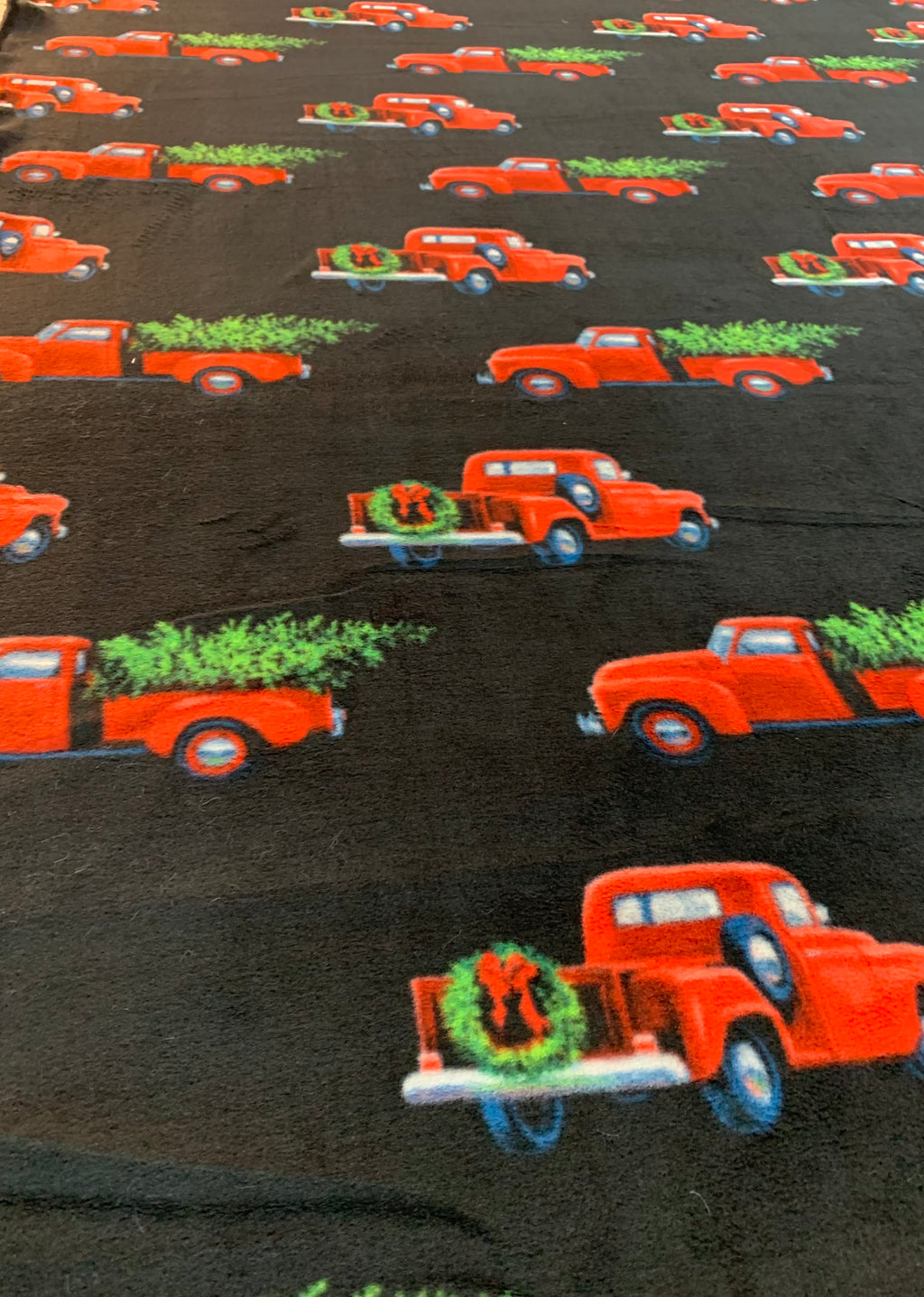 Red Pickup Truck with Christmas Tree Blanket