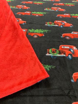 Red Pickup Truck with Christmas Tree Blanket